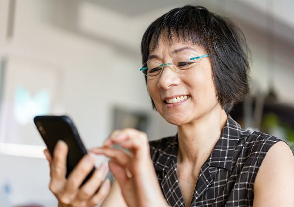 A senior Asian woman taking a spine risk assessment.